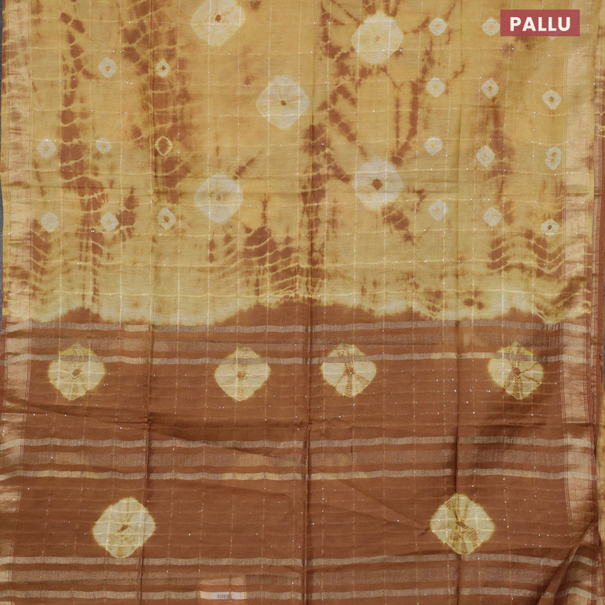 Bamboo saree mustard shade and brown with allover sequin work & batik prints and zari woven border