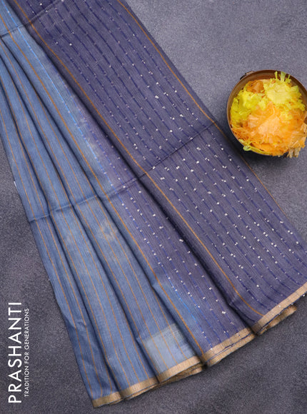 Bamboo saree blue shade with allover zari woven stripes pattern & batik prints and sequin work pallu