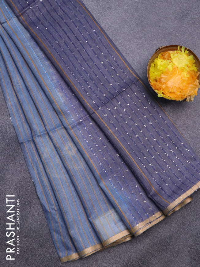 Bamboo saree blue shade with allover zari woven stripes pattern & batik prints and sequin work pallu