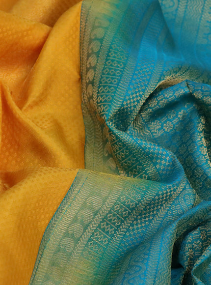 Pure kanchipuram silk saree mango yellow and teal green with self emboss & zari buttas and zari woven border