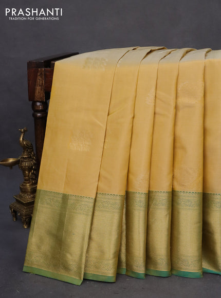 Pure kanchipuram silk saree pale yellow and dual shade of teal green with zari woven buttas and zari woven border