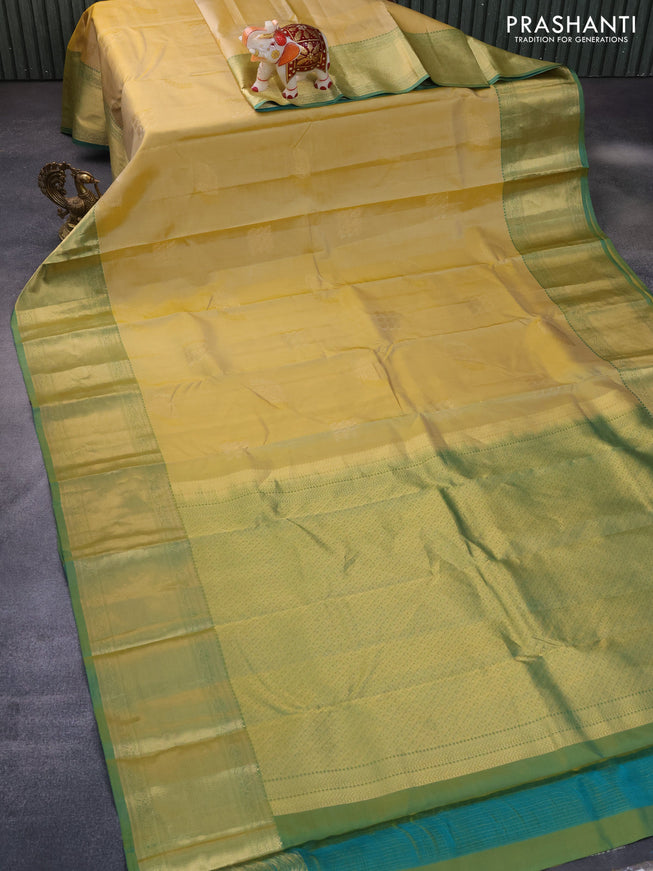 Pure kanchipuram silk saree pale yellow and dual shade of teal green with zari woven buttas and zari woven border