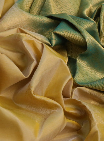 Pure kanchipuram silk saree pale yellow and dual shade of teal green with zari woven buttas and zari woven border