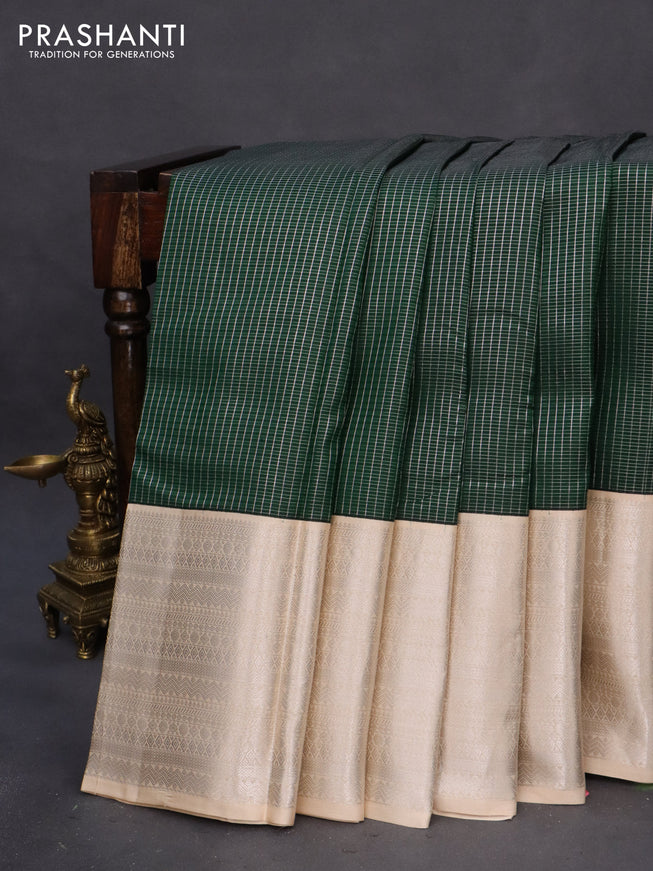 Pure kanchipuram silk saree green and cream with allover small silver zari checks and long silver zari woven border