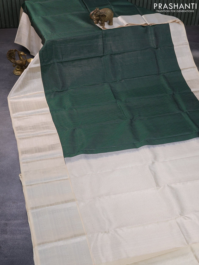 Pure kanchipuram silk saree green and cream with allover small silver zari checks and long silver zari woven border