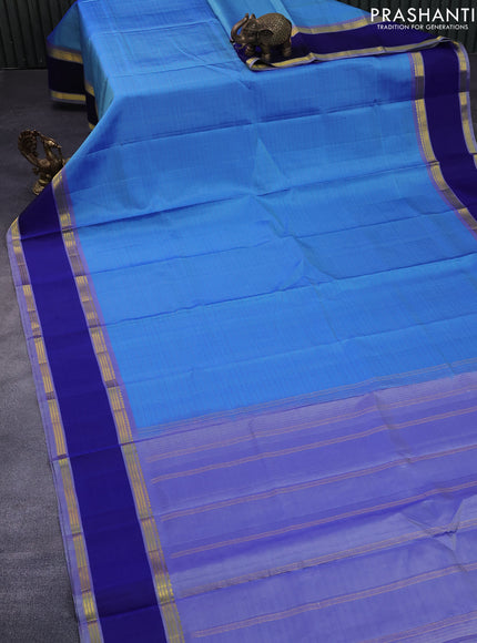 Pure kanchipuram silk saree blue shade and blue with allover checked pattern and rettapet zari woven border