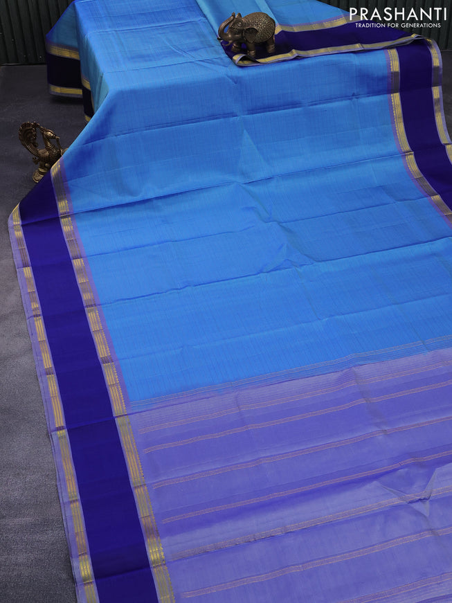 Pure kanchipuram silk saree blue shade and blue with allover checked pattern and rettapet zari woven border