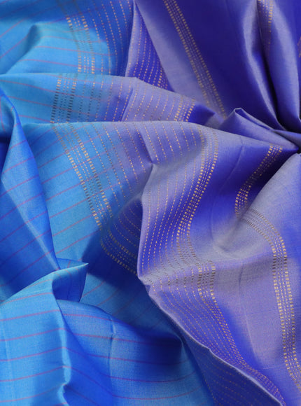 Pure kanchipuram silk saree blue shade and blue with allover checked pattern and rettapet zari woven border