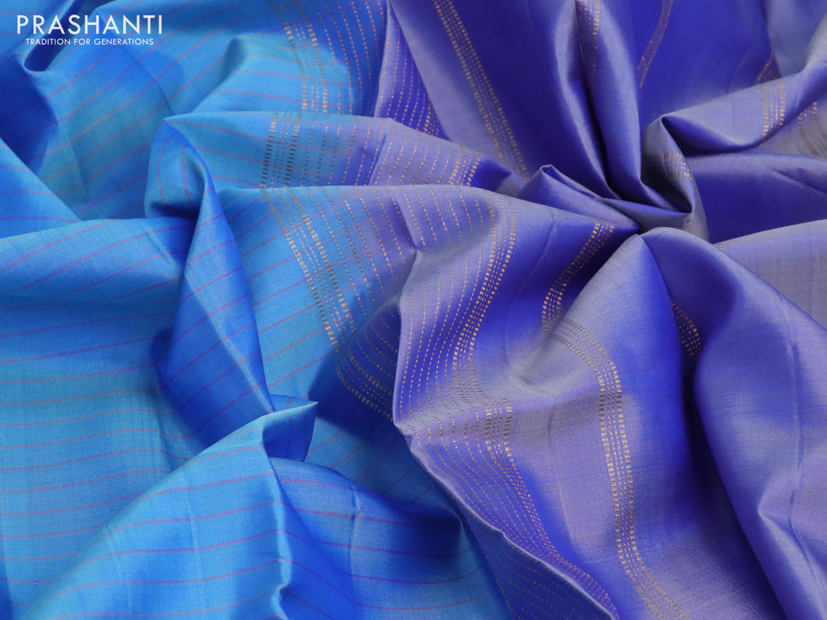 Pure kanchipuram silk saree blue shade and blue with allover checked pattern and rettapet zari woven border