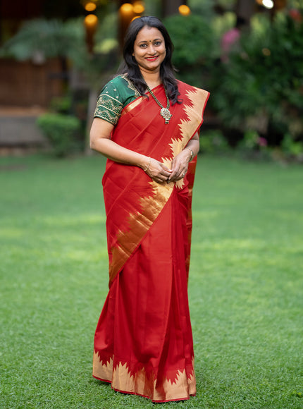 Pure kanchipuram silk saree red with plain body and temple deisgn zari woven border