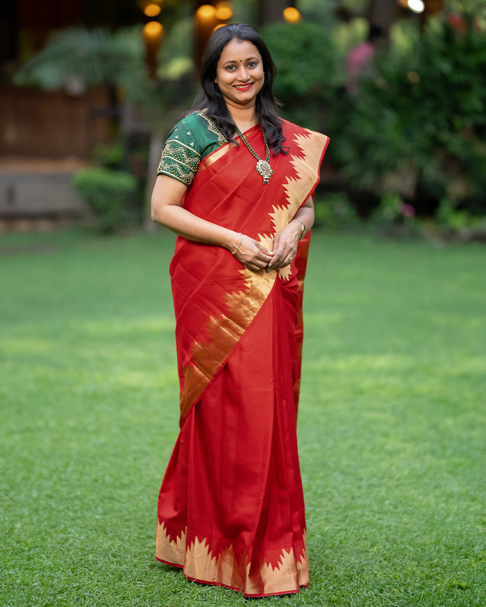 Pure kanchipuram silk saree red with plain body and temple deisgn zari woven border