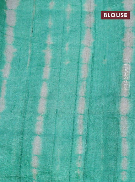 Pure tussar silk saree off white and teal green with allover embroidery work and tie & dye border