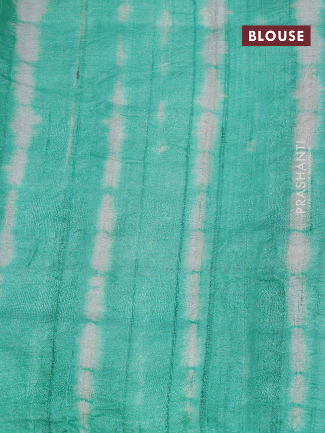 Pure tussar silk saree off white and teal green with allover embroidery work and tie & dye border