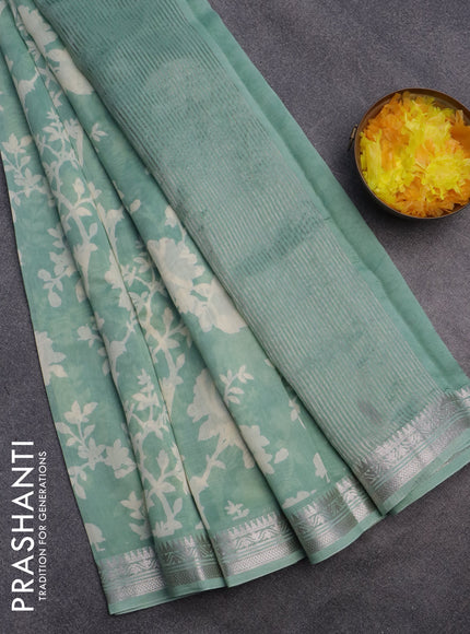 Chanderi silk cotton saree pastel green with allover floral prints and zari woven border