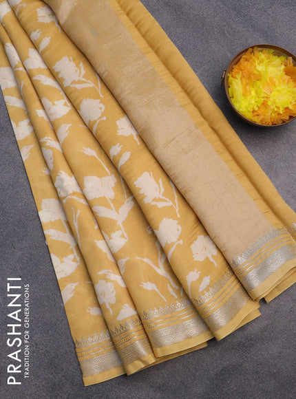 Chanderi silk cotton saree yellow with allover floral prints and silver zari woven border