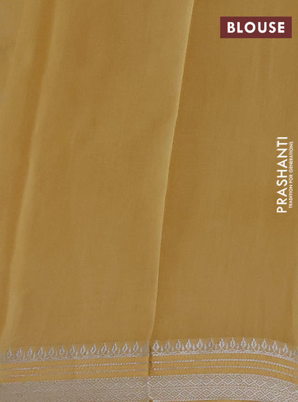 Chanderi silk cotton saree yellow with allover floral prints and silver zari woven border