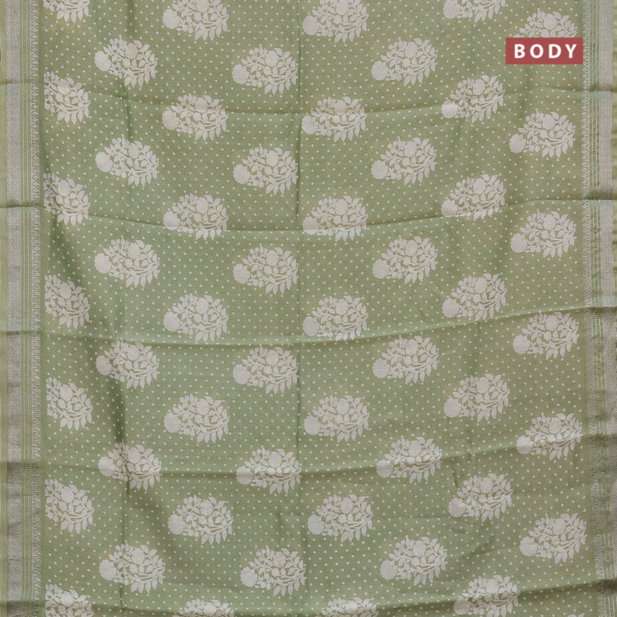 Chanderi silk cotton saree pista green shade with allover floral prints and silver zari woven border