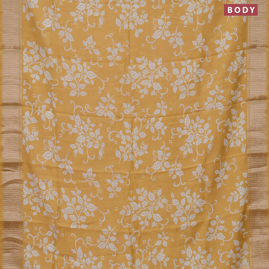 Assam silk saree yellow with allover prints and zari woven border