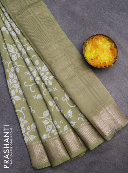 Assam silk saree pastel green with allover prints and zari woven border