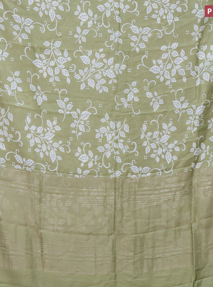 Assam silk saree pastel green with allover prints and zari woven border