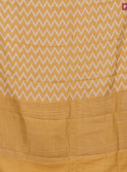 Assam silk saree yellow with allover zig zag prints and zari woven border