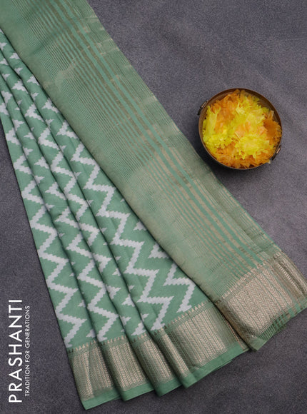 Assam silk saree pastel green with allover zig zag prints and zari woven border