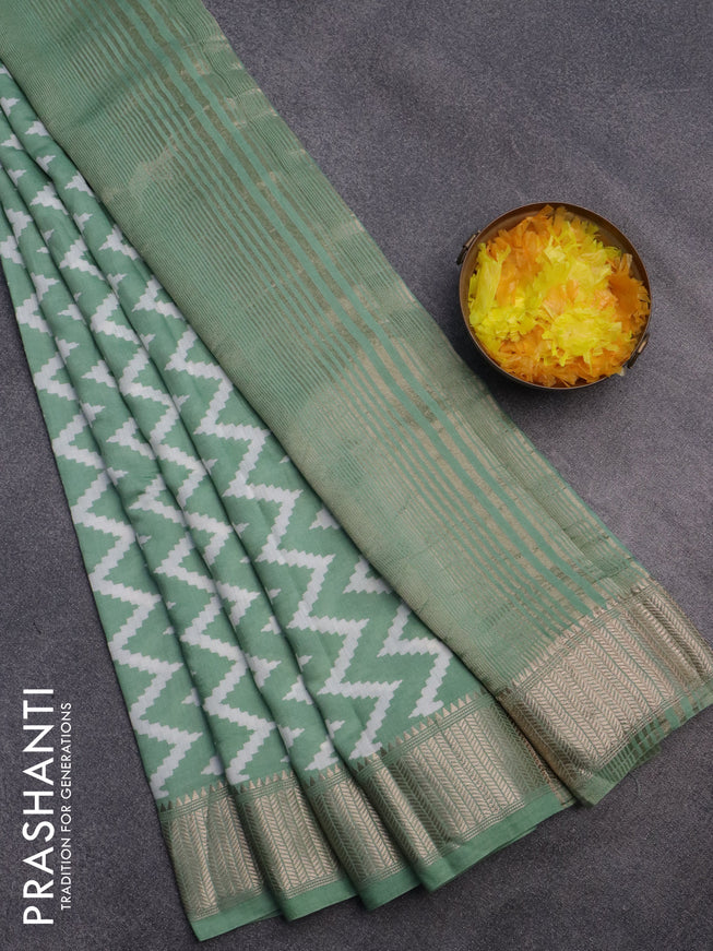 Assam silk saree pastel green with allover zig zag prints and zari woven border