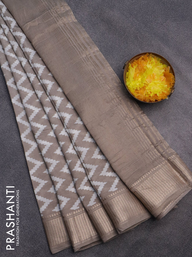 Assam silk saree grey shade with allover zig zag prints and zari woven border