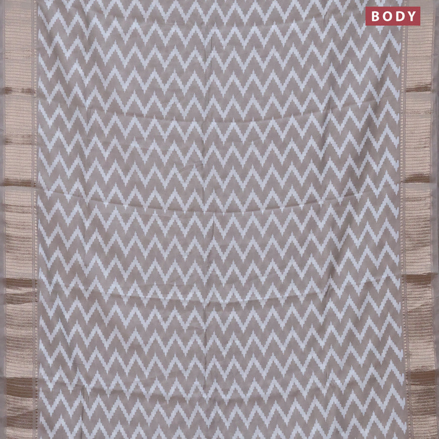 Assam silk saree grey shade with allover zig zag prints and zari woven border