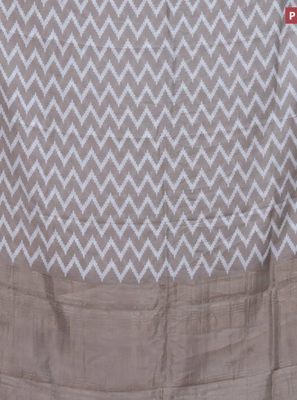 Assam silk saree grey shade with allover zig zag prints and zari woven border