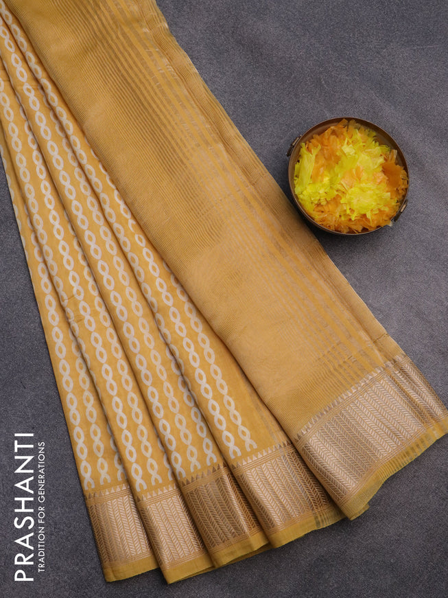 Assam silk saree yellow with allover prints and zari woven border