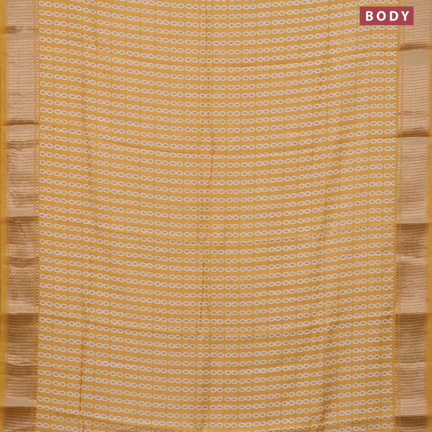 Assam silk saree yellow with allover prints and zari woven border