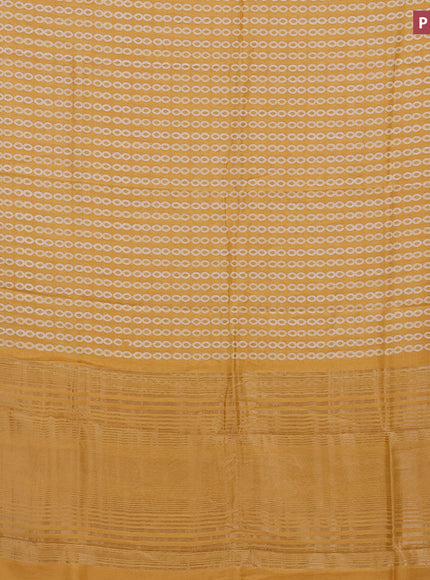 Assam silk saree yellow with allover prints and zari woven border