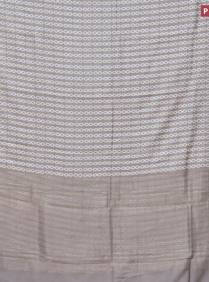 Assam silk saree grey shade with allover prints and zari woven border