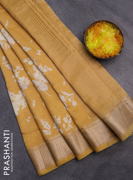 Assam silk saree mustard yellow with allover floral prints and zari woven border