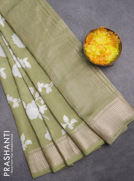 Assam silk saree green shade with allover floral prints and zari woven border