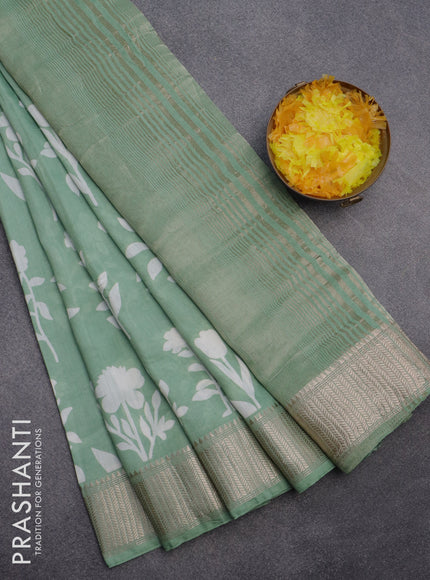 Assam silk saree pastel green with floral butta prints and zari woven border