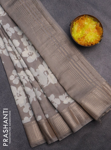 Assam silk saree grey shade with allover floral prints and zari woven border