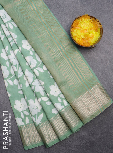 Assam silk saree teal green shade with allover floral prints and zari woven border