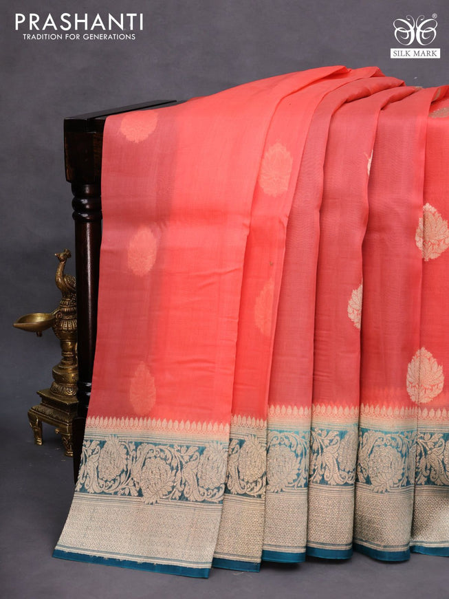 Banarasi organza saree orange and peacock blue with woven buttas and floral zari woven border