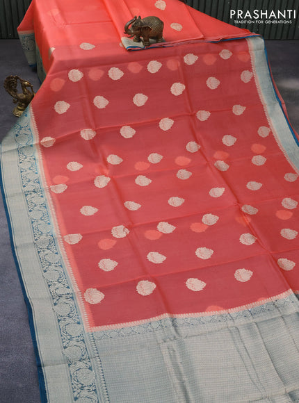 Banarasi organza saree orange and peacock blue with woven buttas and floral zari woven border