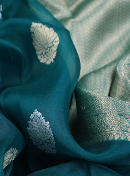 Banarasi organza saree teal blue with woven buttas and woven border