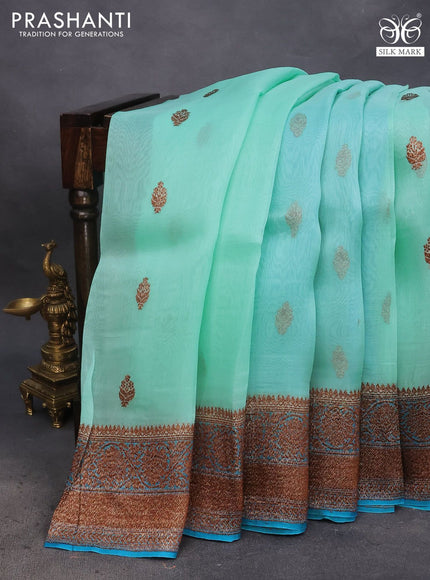 Banarasi organza saree teal blue shade and cs blue with thread & zari woven buttas and banarasi style border