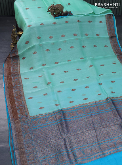 Banarasi organza saree teal blue shade and cs blue with thread & zari woven buttas and banarasi style border