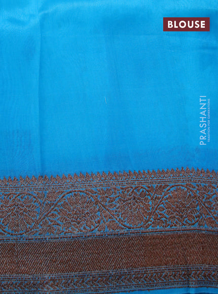 Banarasi organza saree teal blue shade and cs blue with thread & zari woven buttas and banarasi style border