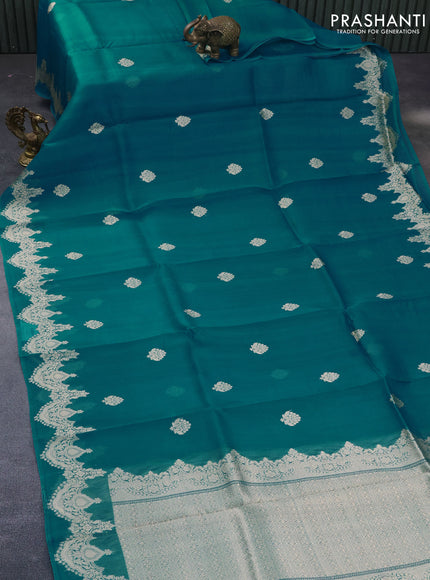 Banarasi organza saree teal blue with woven buttas and zari woven butta border