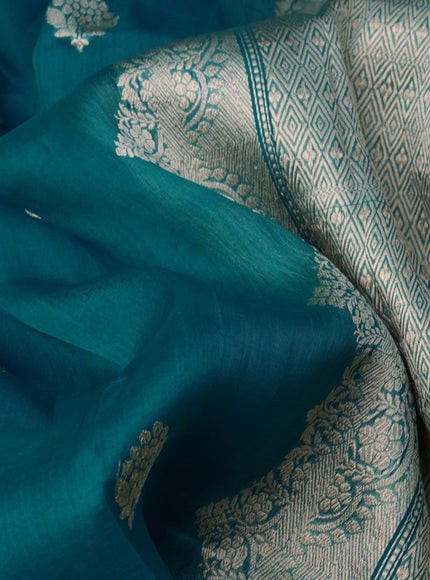 Banarasi organza saree teal blue with woven buttas and zari woven butta border