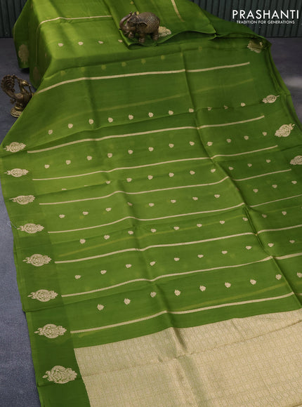 Banarasi organza saree green shade with allover zari weaves and zari woven butta border