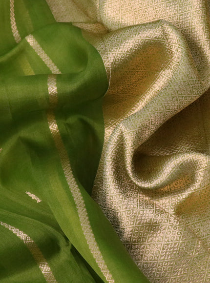 Banarasi organza saree green shade with allover zari weaves and zari woven butta border