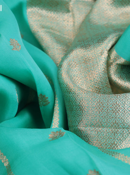 Banarasi organza saree teal shade with allover zari weaves and zari woven butta border